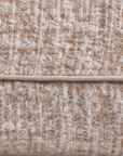 Close-up of ivory body pillow fabric texture with stitched edge detail