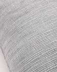 Light blue-gray big lumbar pillow close-up showing fine woven fabric texture