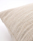 Natural big lumbar pillow close-up showing woven fabric texture and stitched edge