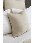 Natural 20x20 woven square throw pillow with insert, on white bedding, solid beige