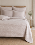 Quilted oatmeal bedding set with textured duvet cover and matching sham pillows