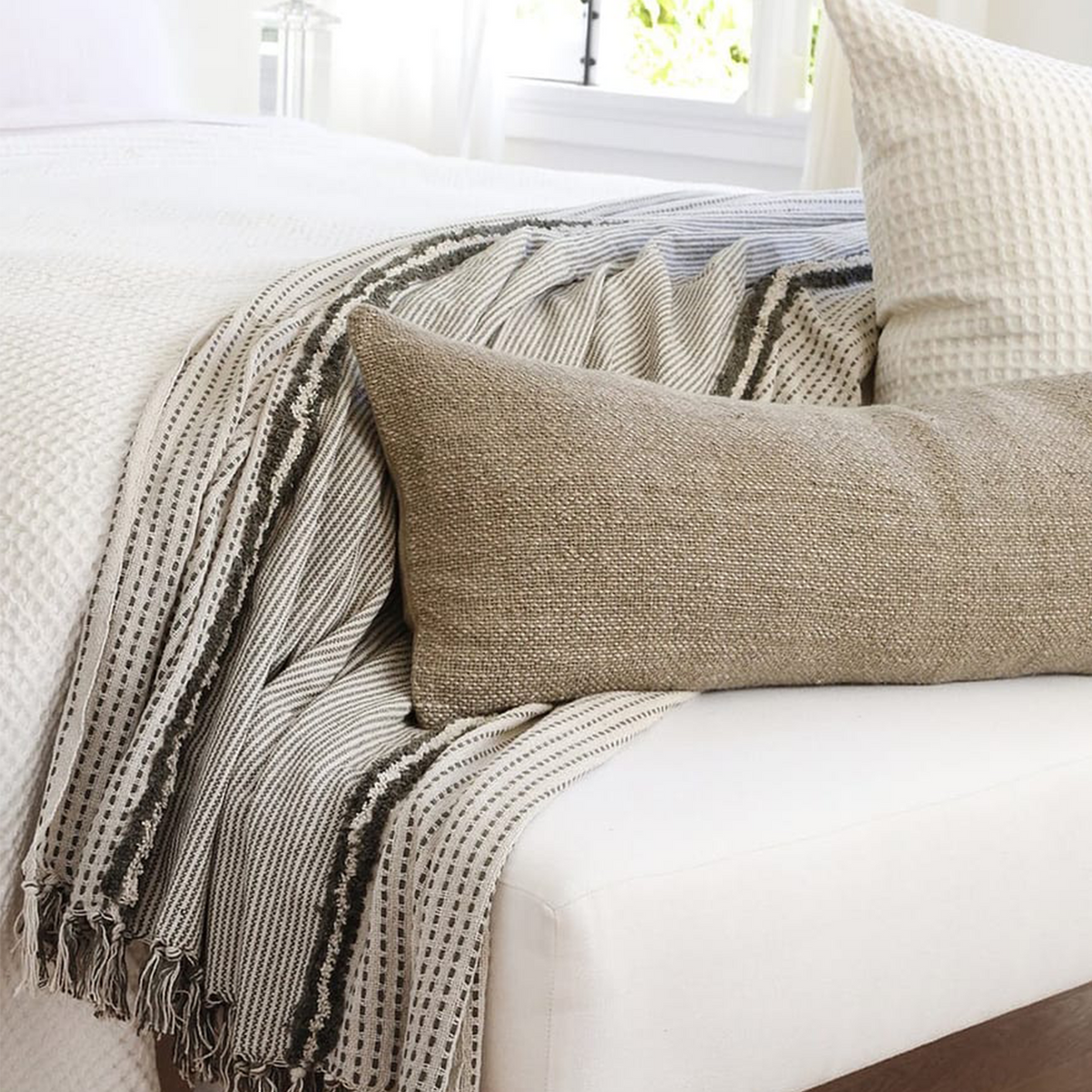 Textured striped throw blanket with fringe, cream base and dark gray lines