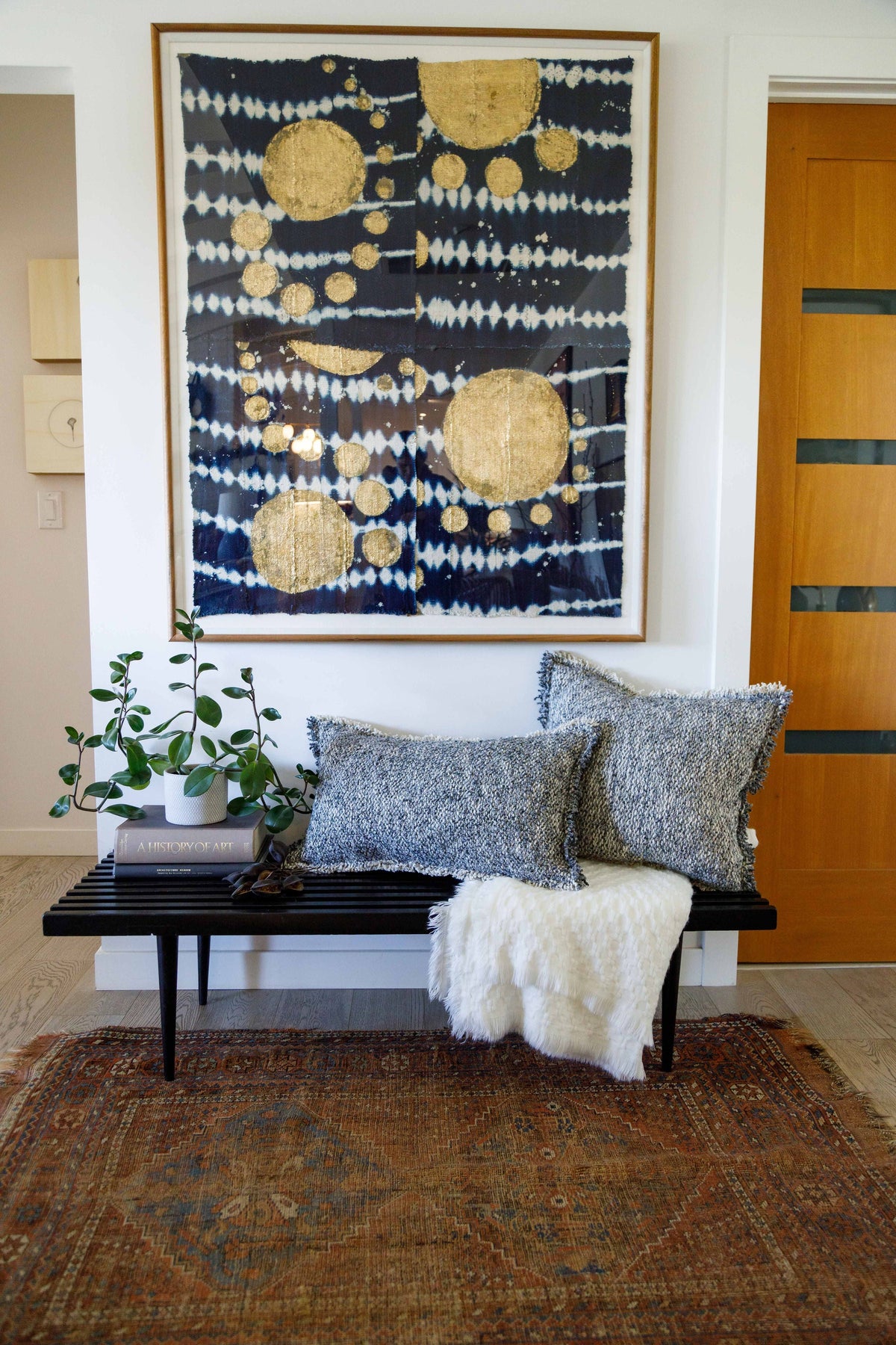 20x20 textured pillow with insert, light gray, on bench with matching fringed pillow behind.