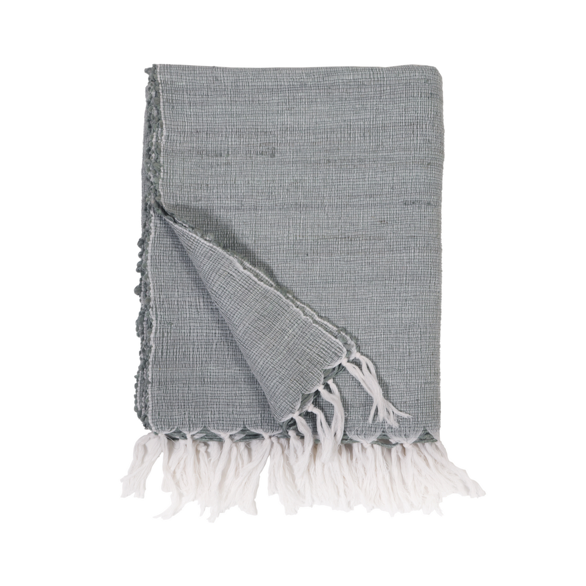 Shore Blue woven throw with white tassel fringe and diagonal fold detail