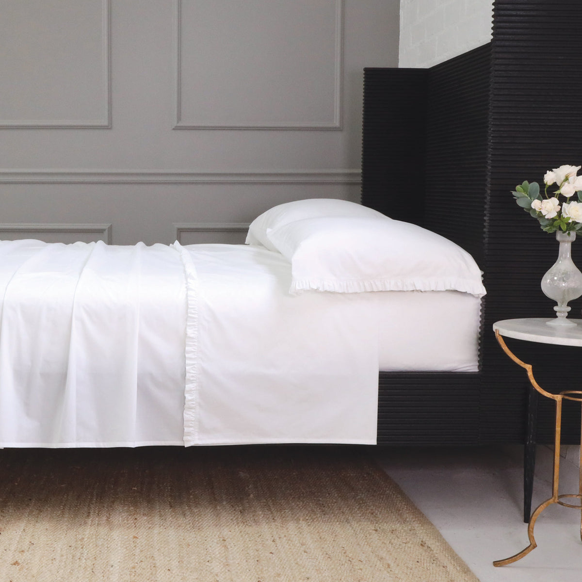 White cotton percale sheet set with ruffle-trimbed pillowcases and bed skirt detail