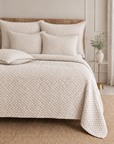 Quilted oatmeal bedding set with textured duvet cover and matching square shams