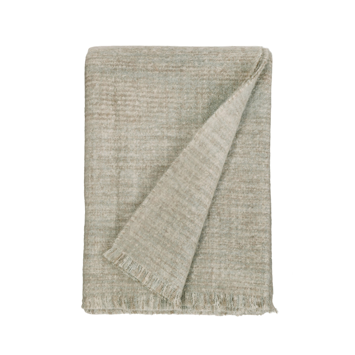 Oversized throw blanket in pale sage gray with textured weave and fringed edge.