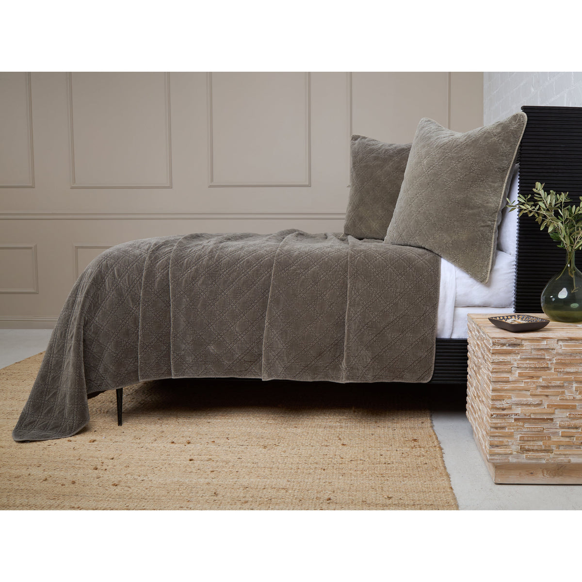 Pewter gray quilted coverlet with diamond quilting and a relaxed bedspread drape.