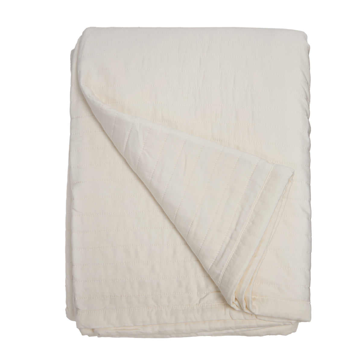 Ivory quilted oversized throw blanket with diagonal stitched pattern and soft drape