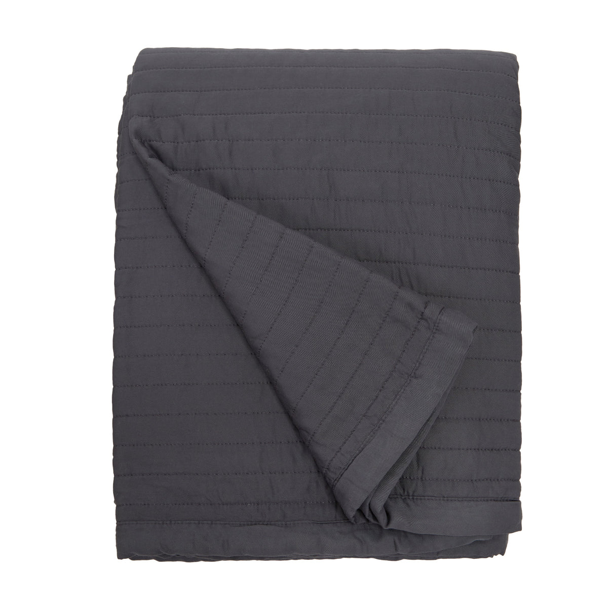 Midnight dark quilted oversized throw blanket with diagonal fold and horizontal stitching