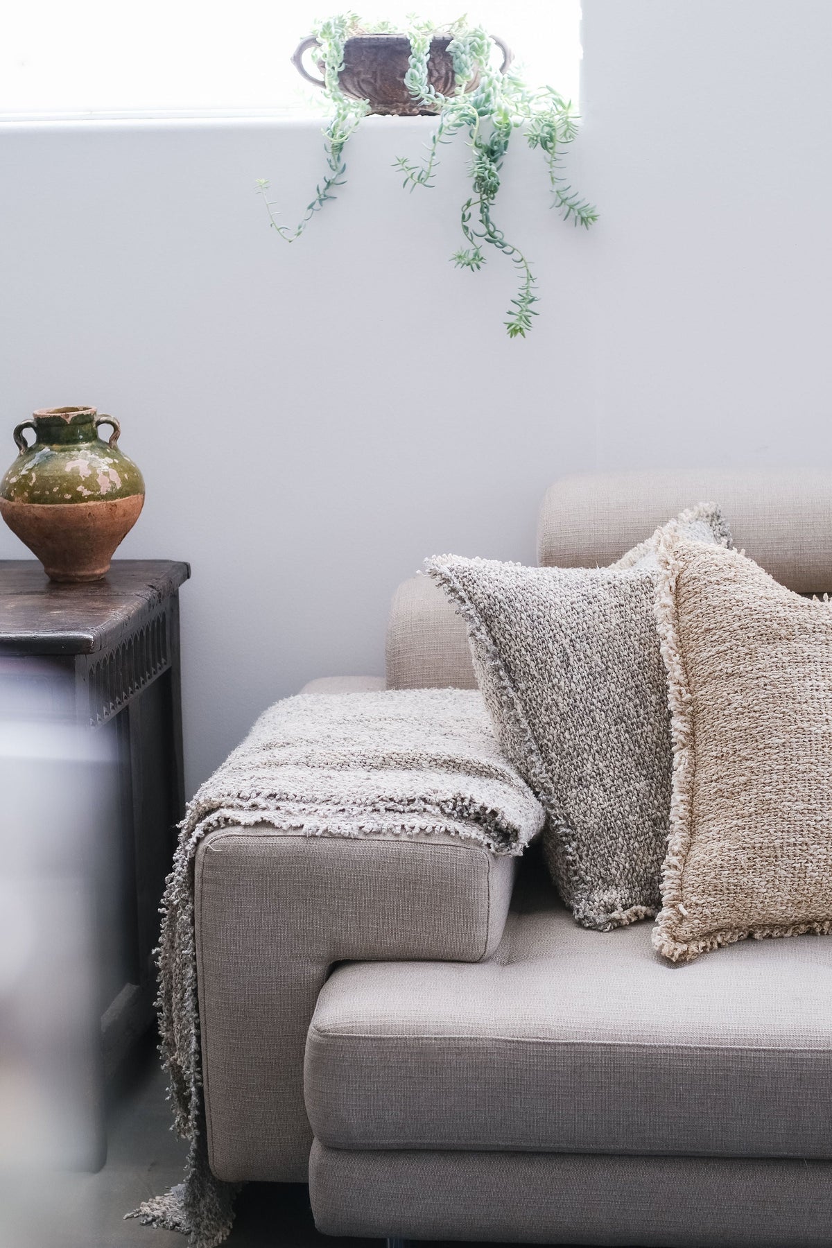 20x20 textured pillow with insert, beige stone tone, two pillows with frayed trim.