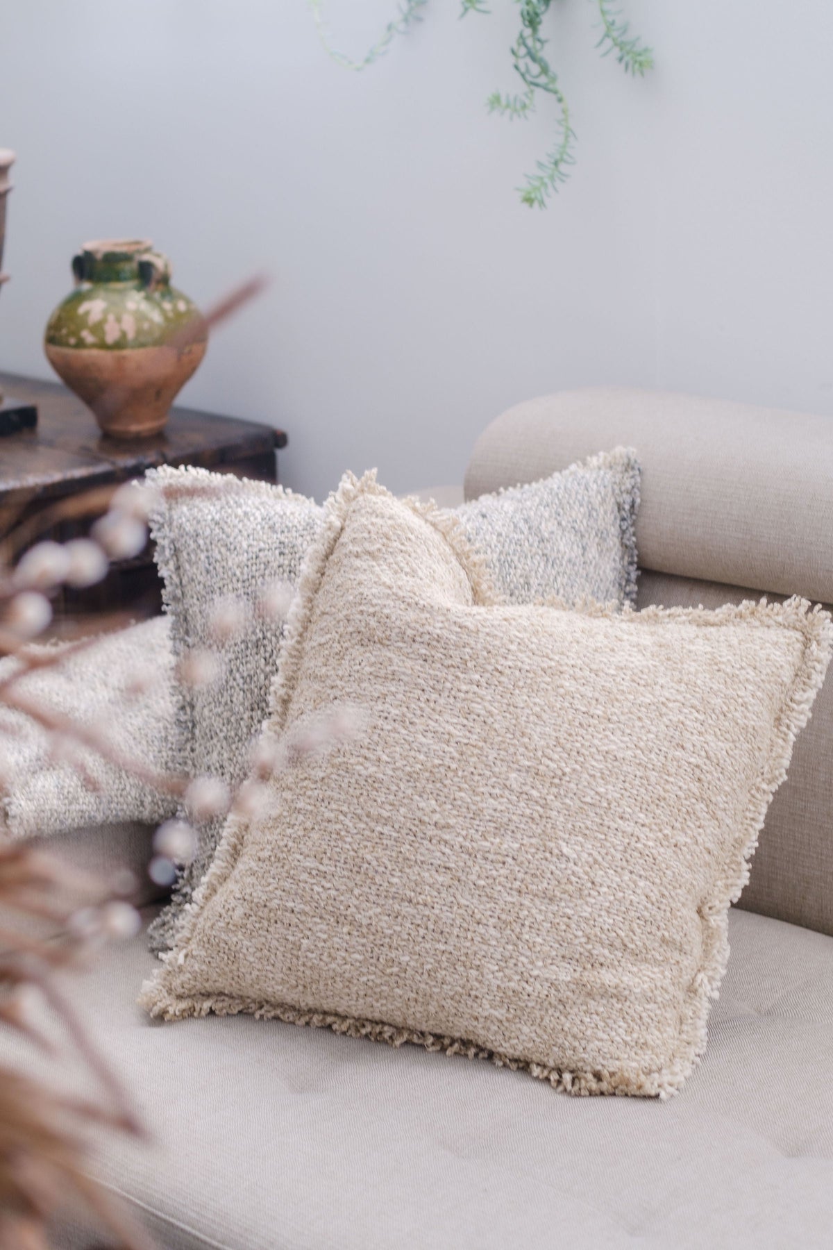 20x20 textured pillow with insert, natural beige, square design with fringe trim.