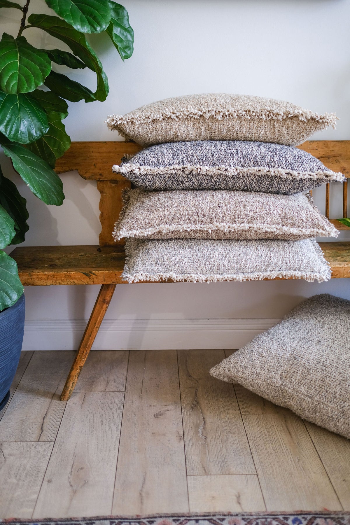 Textured 14x24 pillow with fringe trim, stacked beige and gray inserts