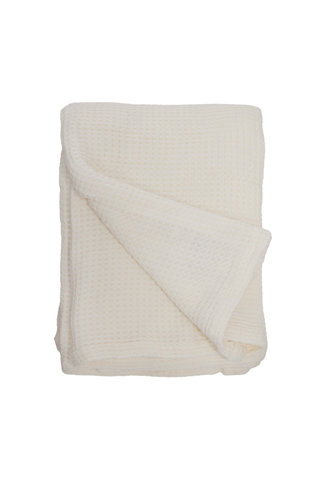 Ivory waffle-knit oversized throw blanket, folded with diagonal drape on a white background.