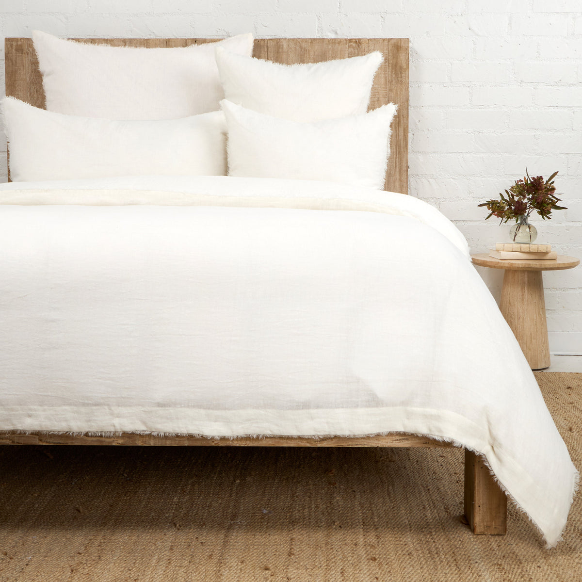 Hunter duvet cover set in white with layered pillow shams and soft texture