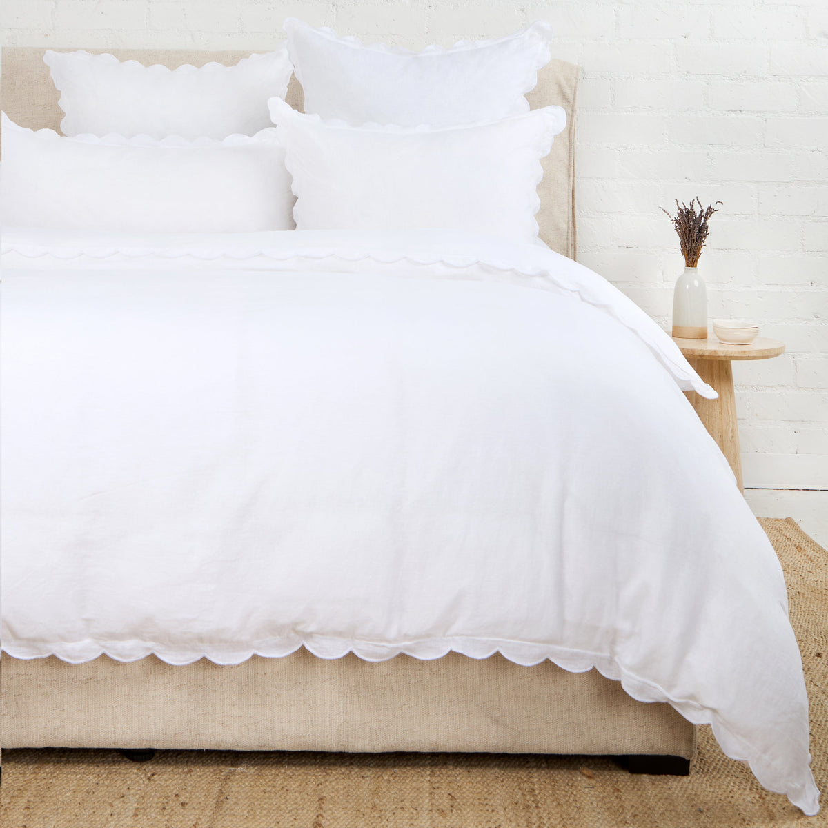 White scalloped duvet cover with decorative pillow shams