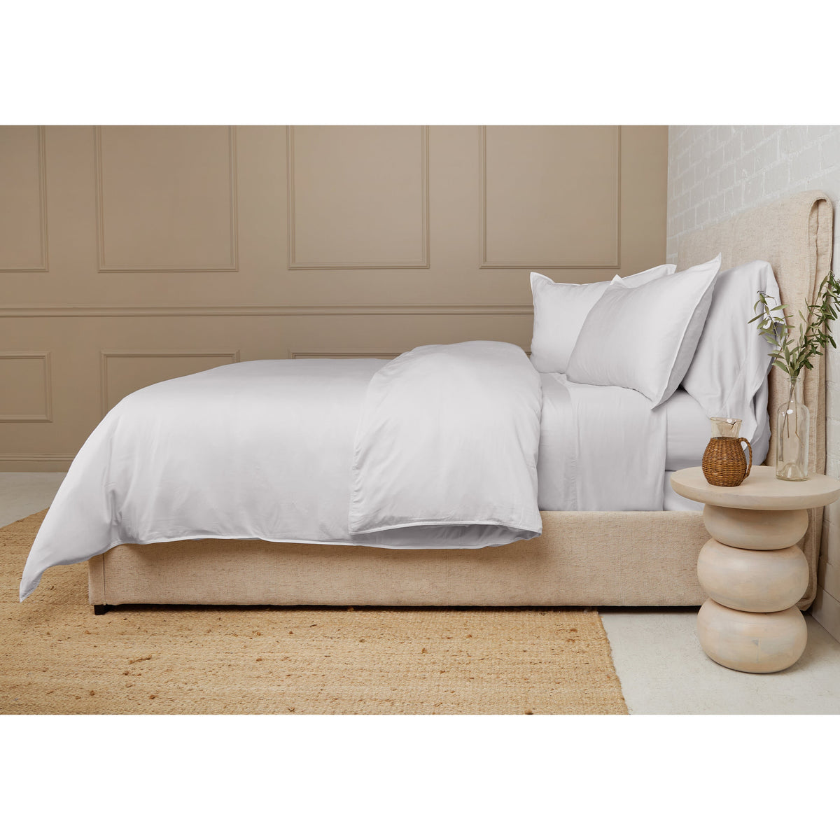 Ivory bamboo sateen duvet set with two pillow shams and folded duvet