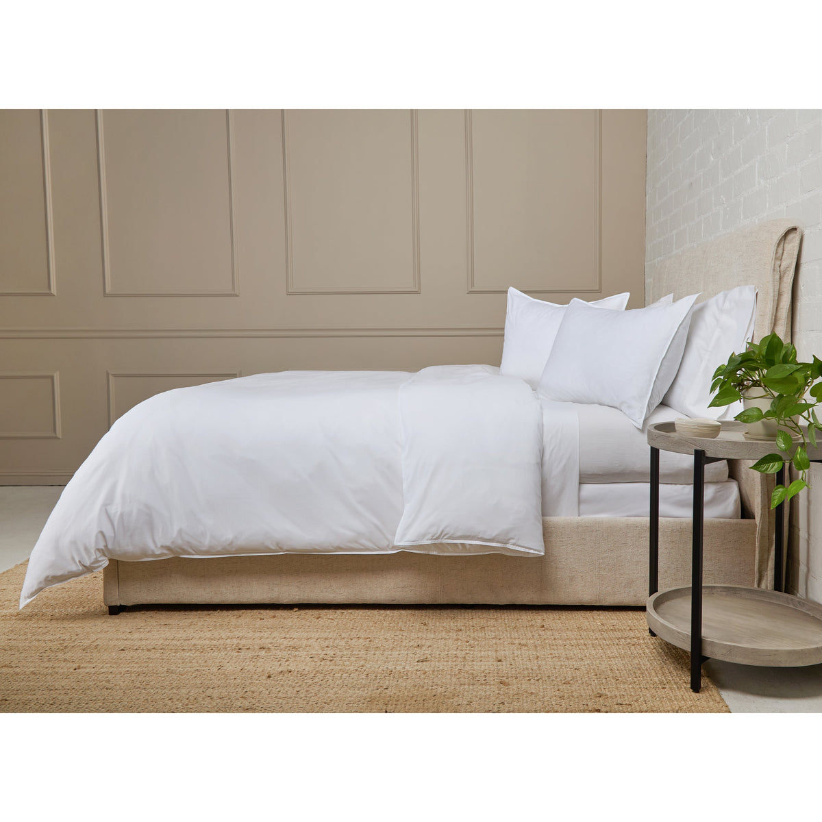 White cotton percale duvet set with matching pillow shams on bed