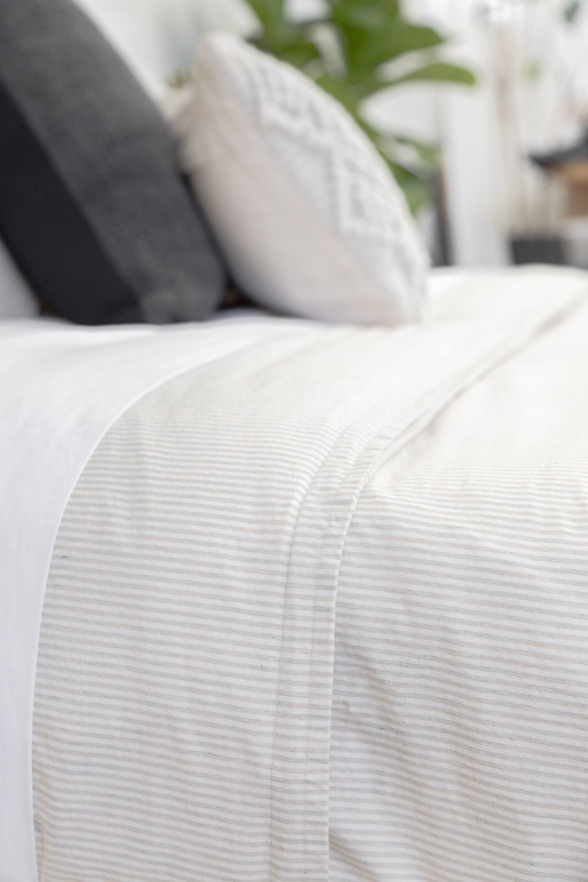 Natural duvet cover fabric with fine horizontal stripes and seam stitching