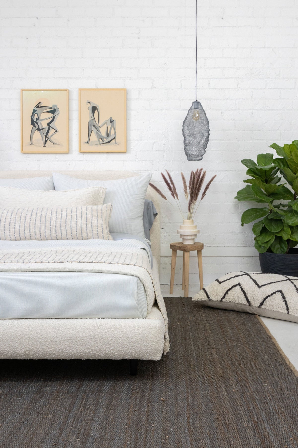 14x40 pillow with insert in ivory and blue-gray stripes on a couch and bedding set