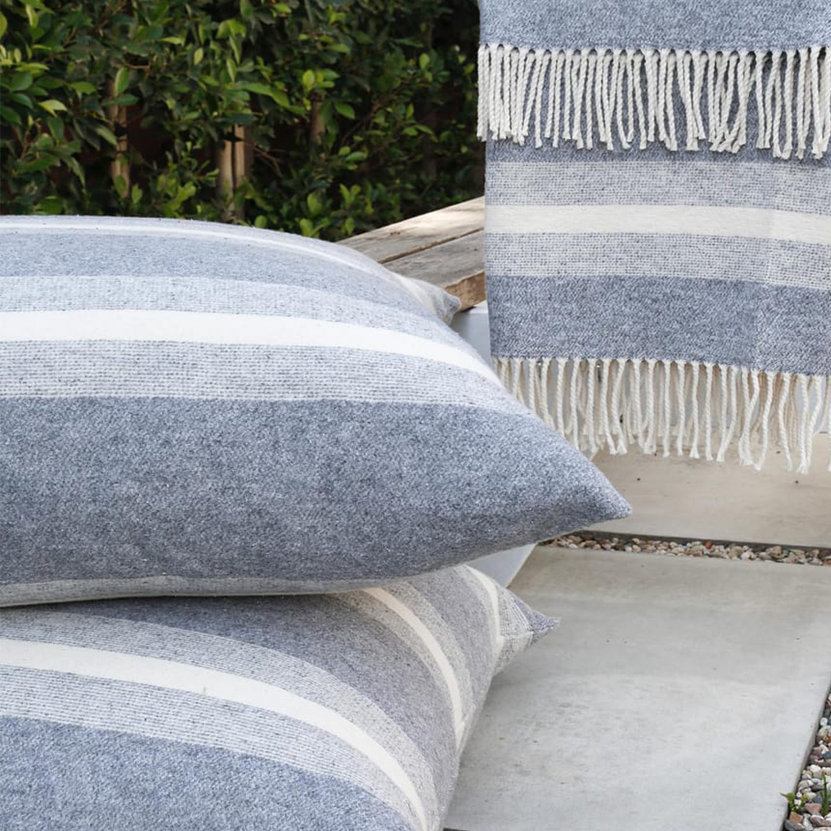 Gray-and-white striped rectangular pillow with visible stitching