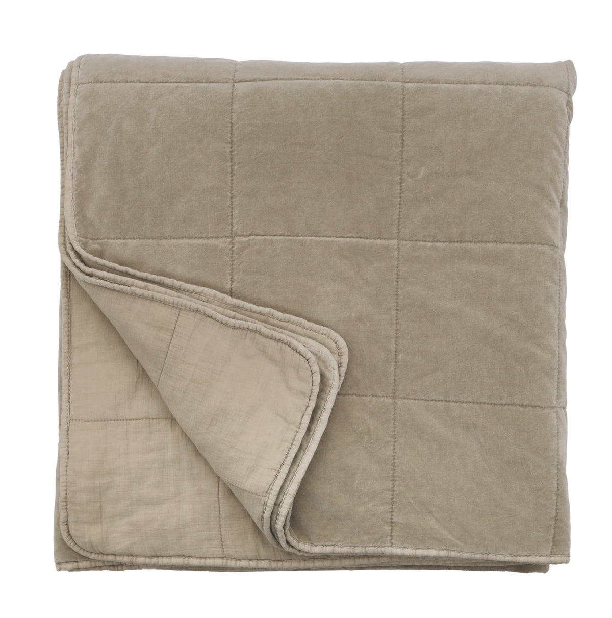 Oversized throw blanket in taupe, folded with stitched quilted grid and rounded edge