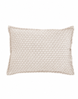 White matelasse rectangular sham pillow with textured circular pattern.