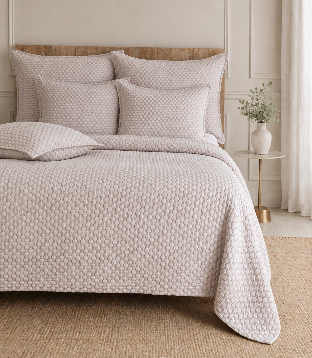 Quilted oatmeal bedding set with textured duvet cover and matching sham pillows
