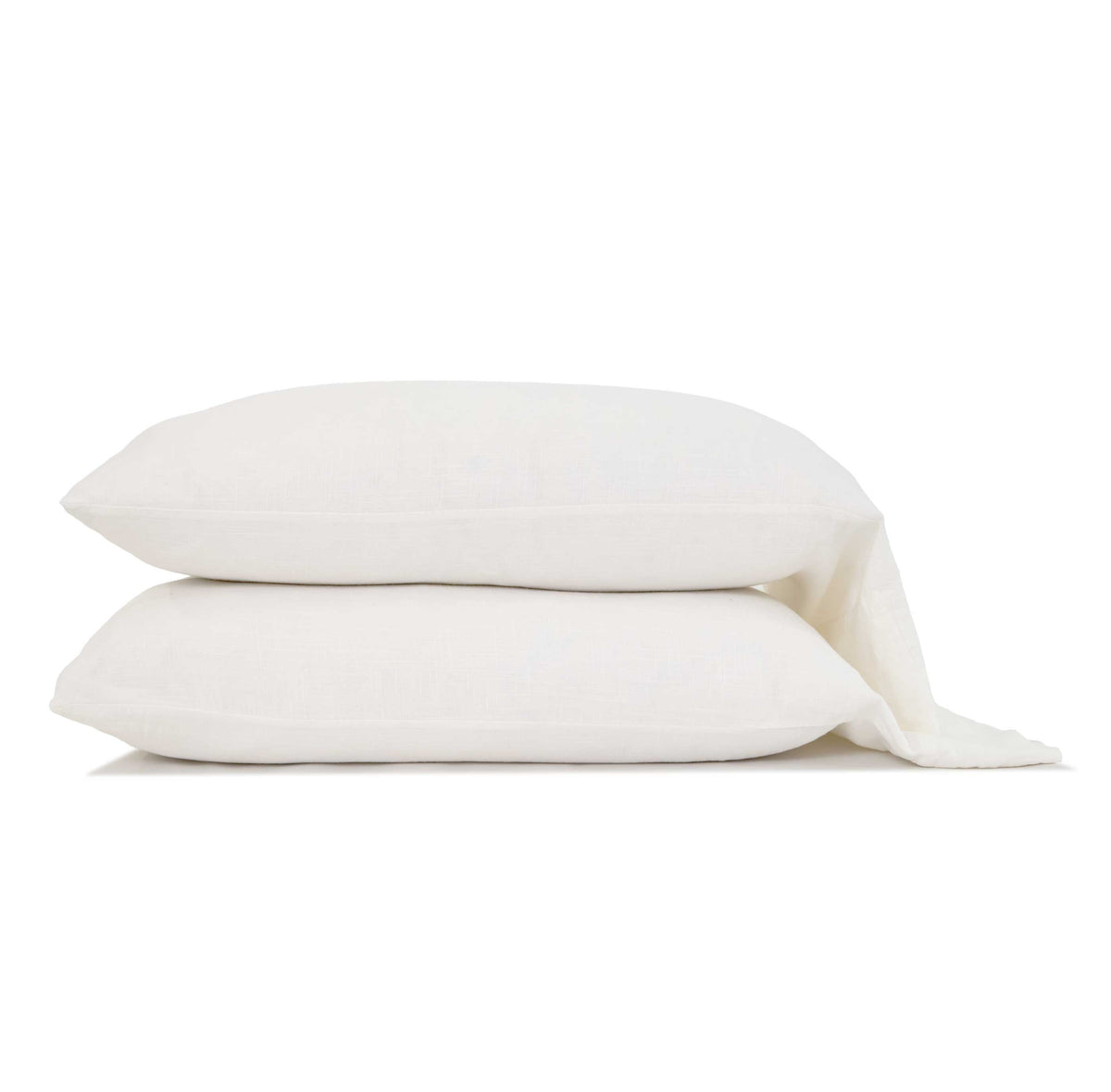 White bamboo linen pillowcases set with two folded pillows and matching fabric on a white background.