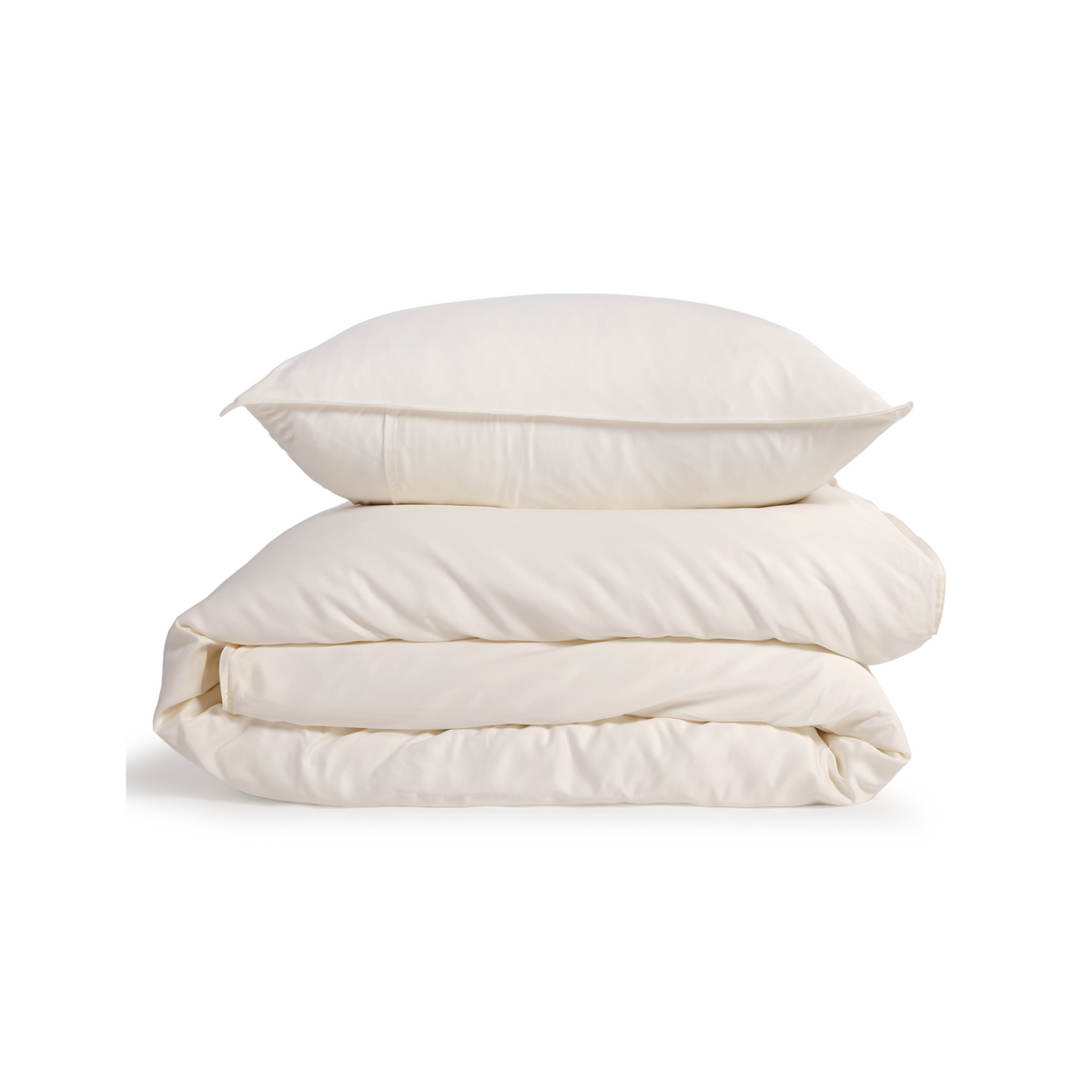 Ivory bamboo sateen duvet set stacked with two pillows on a plain background