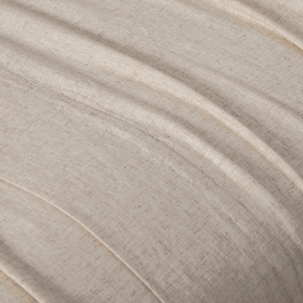 Natural bamboo linen sheet fabric close-up with fine textured weave and stitched seam.