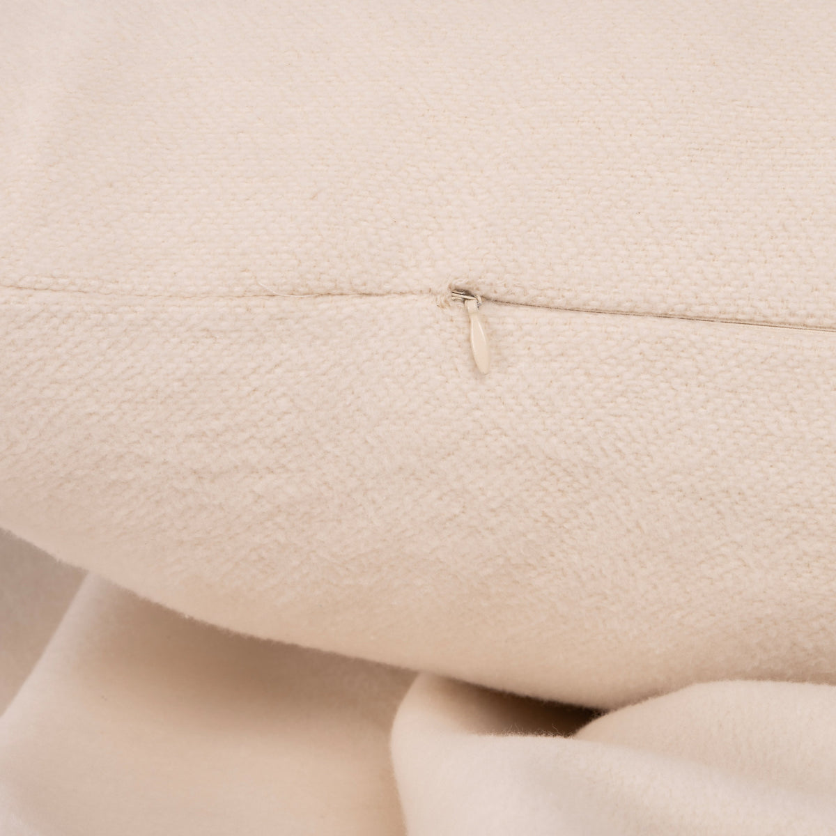 Ivory 28x36 big pillow with insert, close-up zipper seam on pillow edge