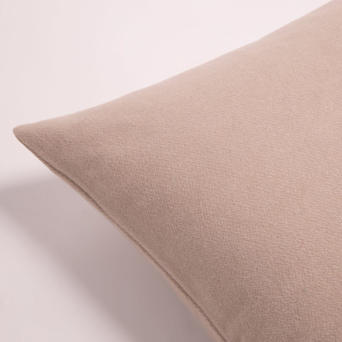 Taupe blanket corner with smooth, tightly woven fabric