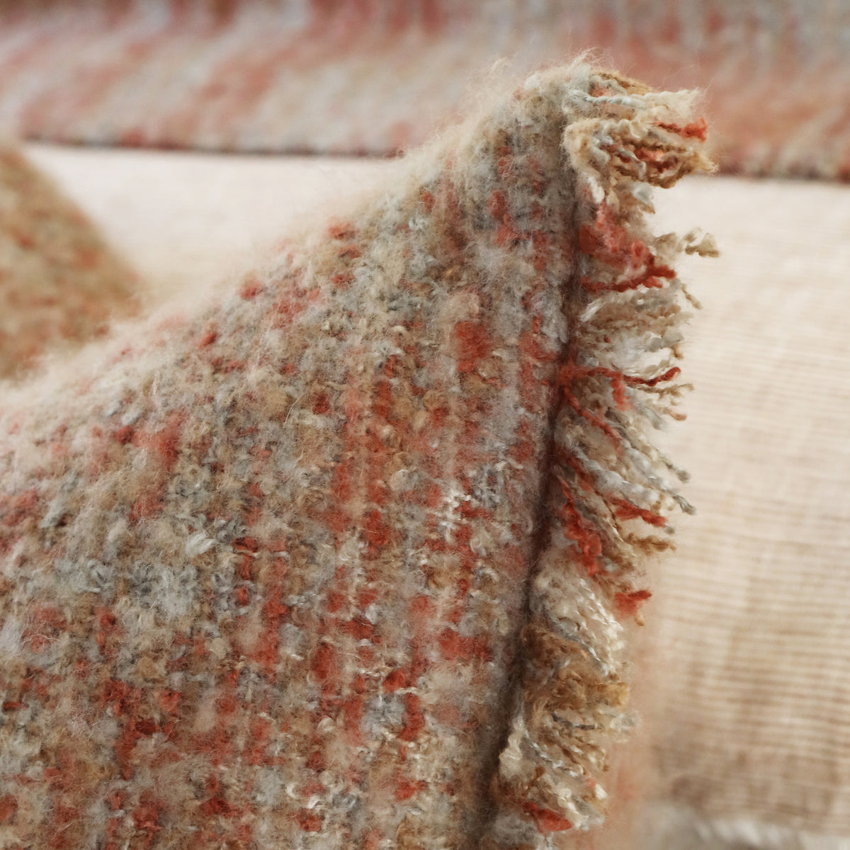 14x24 pillow with insert, textured multi-color fabric and fringed edge