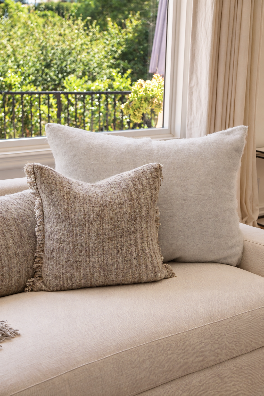 Decorative throw pillow with insert, beige textured weave and subtle fringe