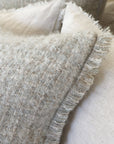 Decorative throw pillow with insert, off-white textured fabric with frayed fringe