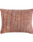 Rectangular decorative pillow with rust orange textured weave and stitched edges