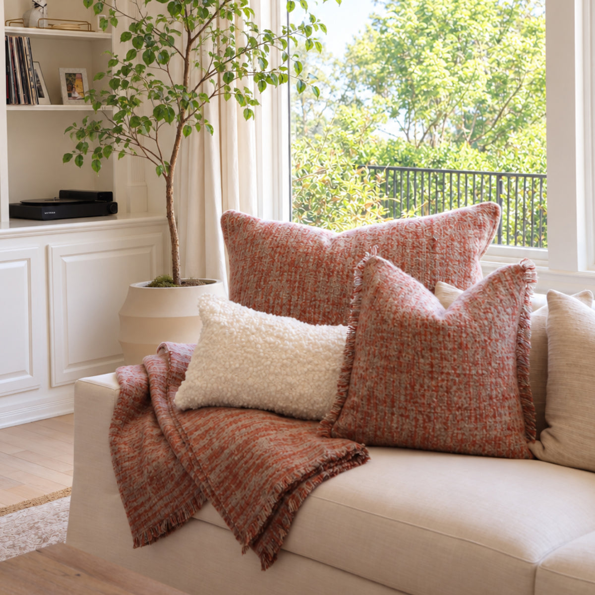 Decorative throw pillows with insert, rust-orange textured fabric and fringe