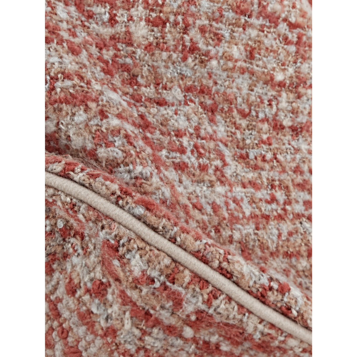 Close-up of redwood body pillow fabric with speckled texture and piping