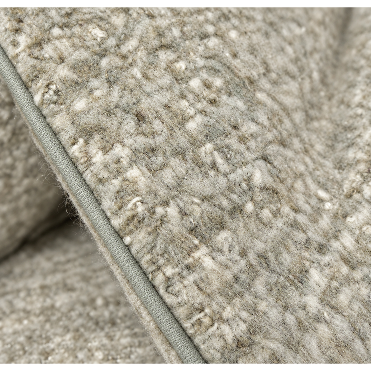 Close-up of stone/moss body pillow fabric with textured woven pattern