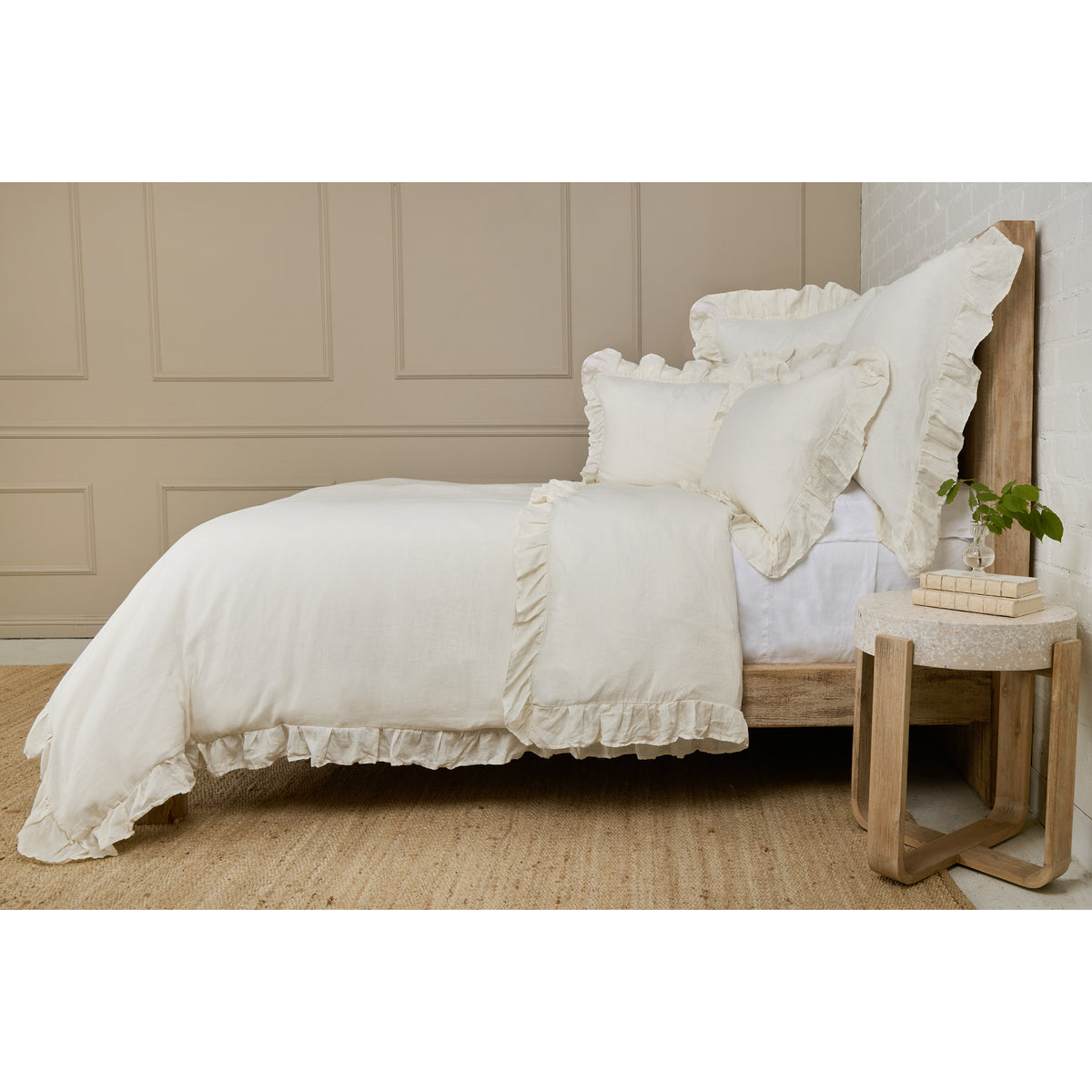 White duvet cover with ruffled hem and coordinating pillow shams