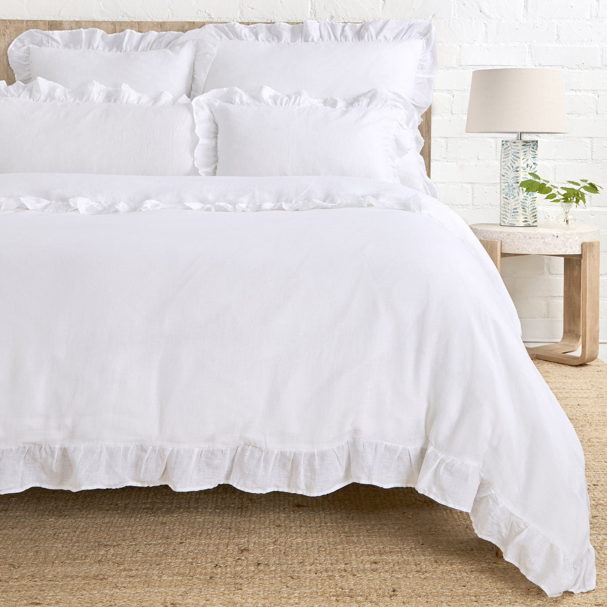 White duvet cover with gathered ruffle trim along the edges