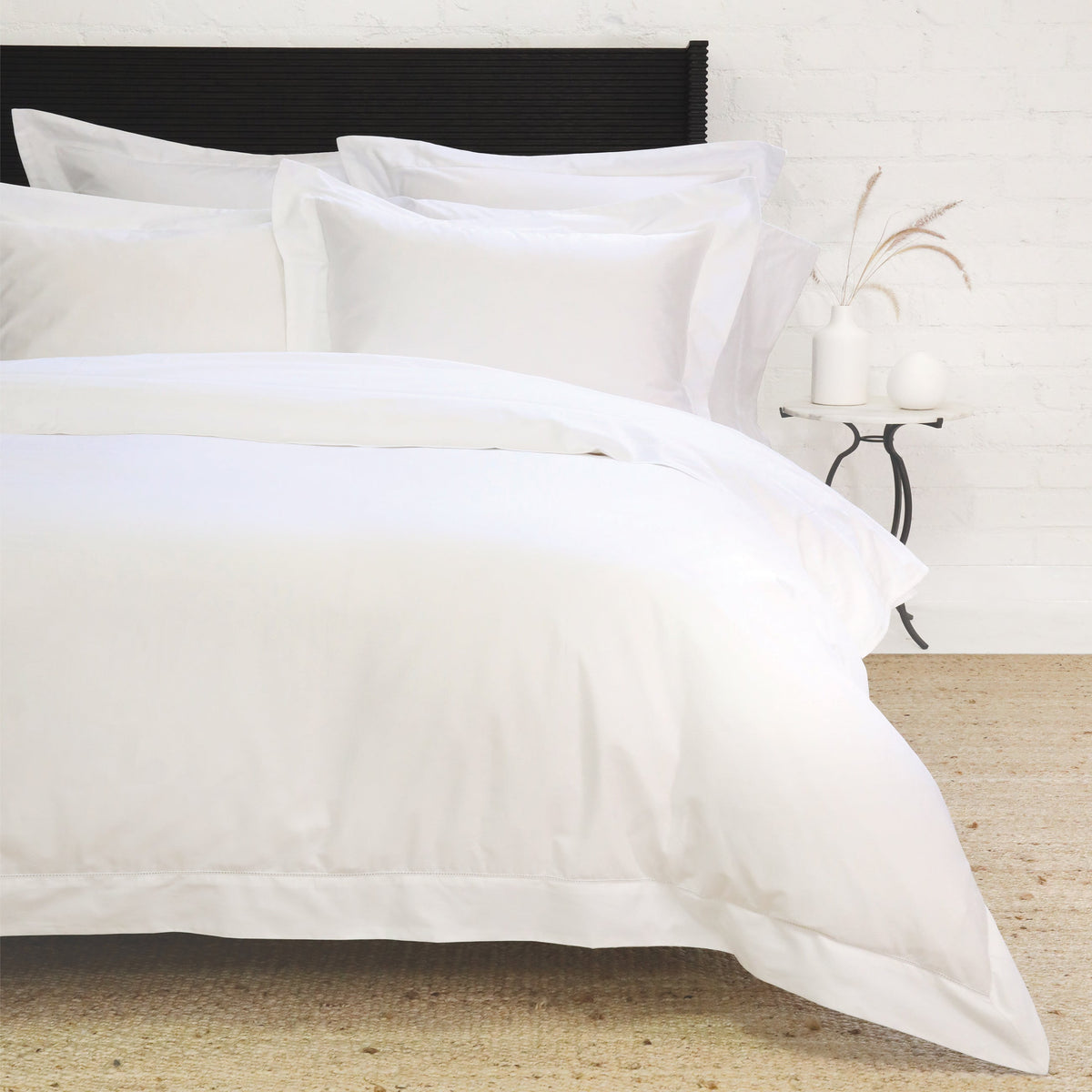 White cotton sateen duvet cover set with matching shams and stitched edge