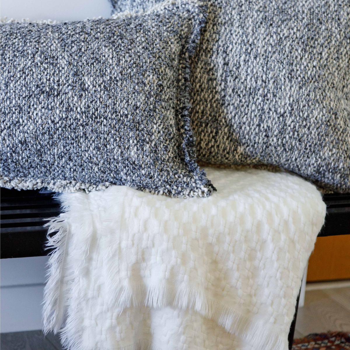 Delphine oversized throw with woven texture and fringe on the corner edge