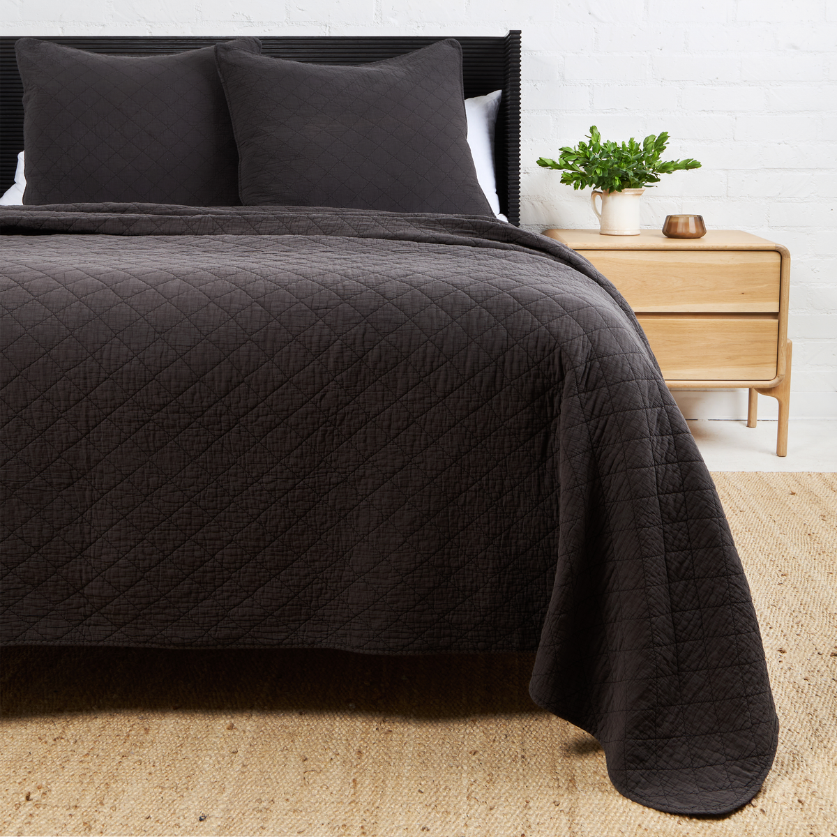 Midnight Huntington coverlet with diamond quilt texture and neatly draped overhang.