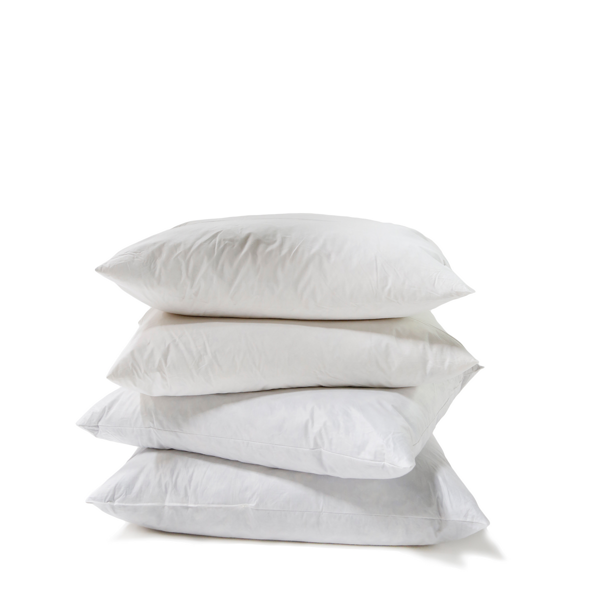 White pillow inserts stacked in a neat pile