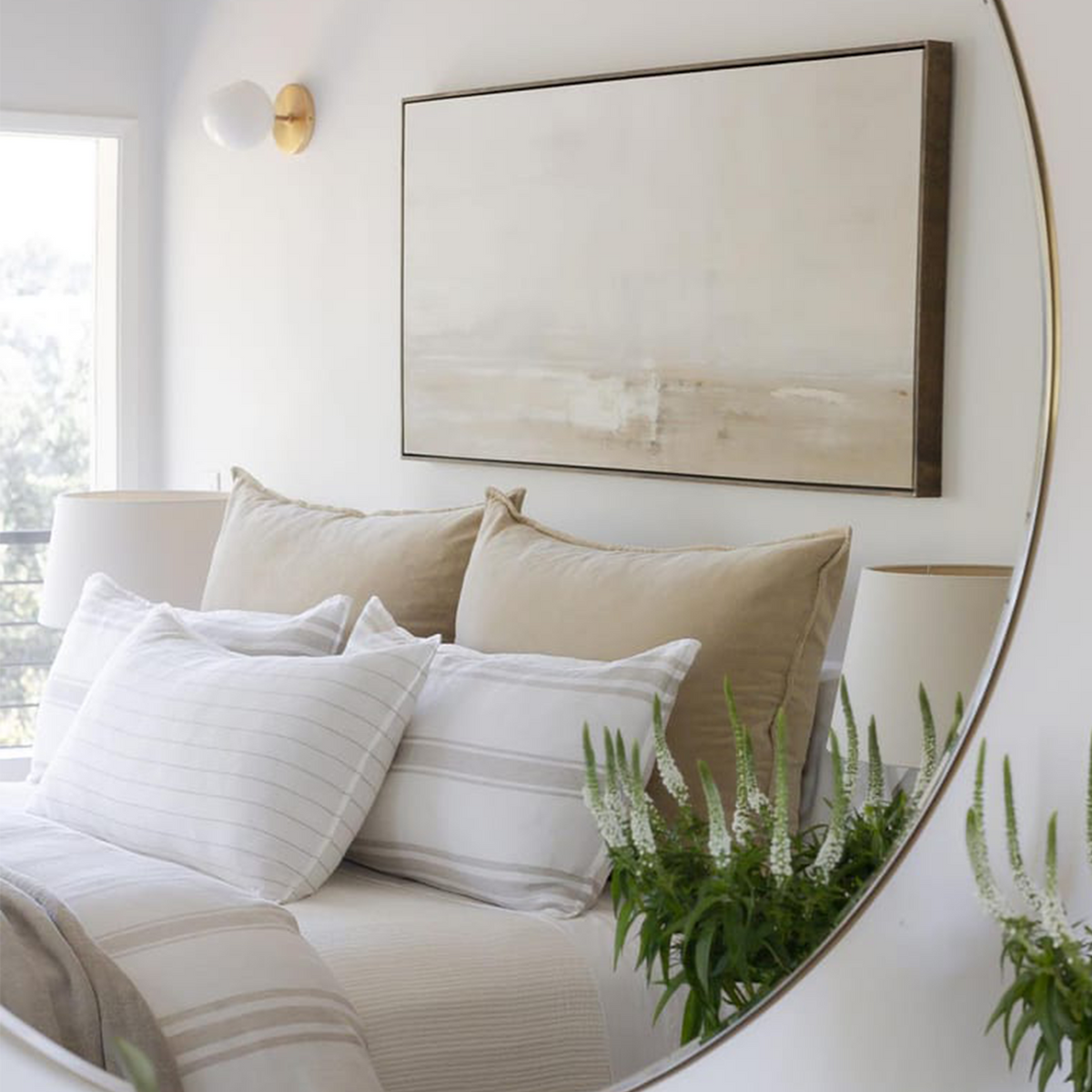Beige-toned duvet cover set with thin stripe accents on pillows