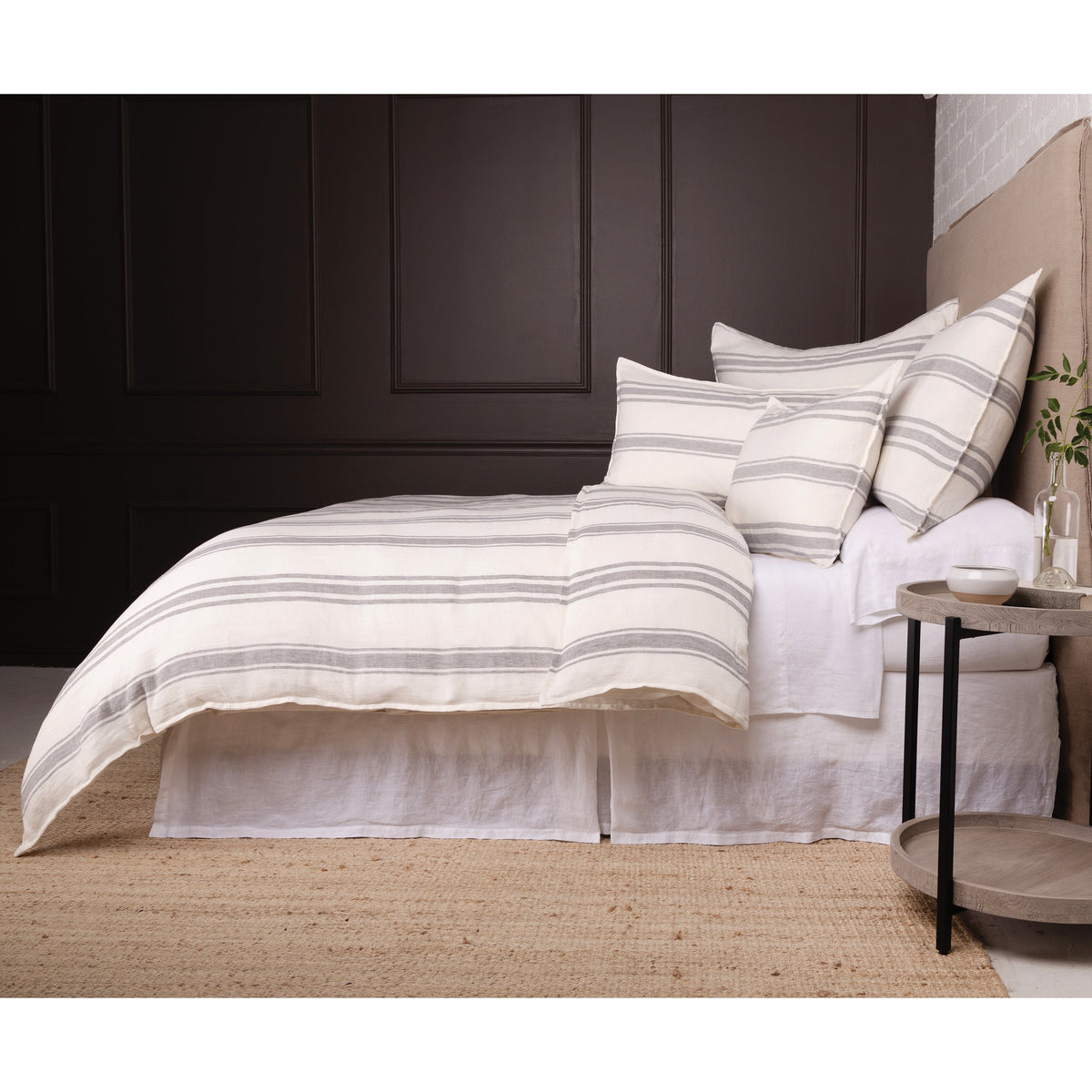 White duvet cover set with horizontal gray stripes and coordinating striped shams