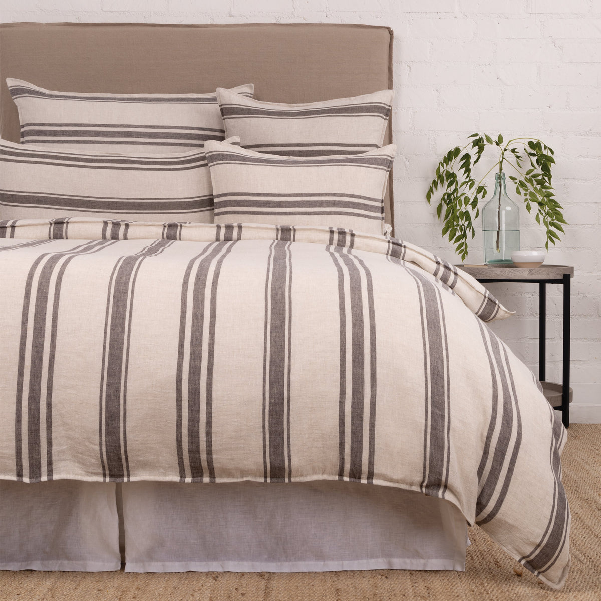 Duvet cover set in white with gray vertical stripes, layered shams and pillow covers