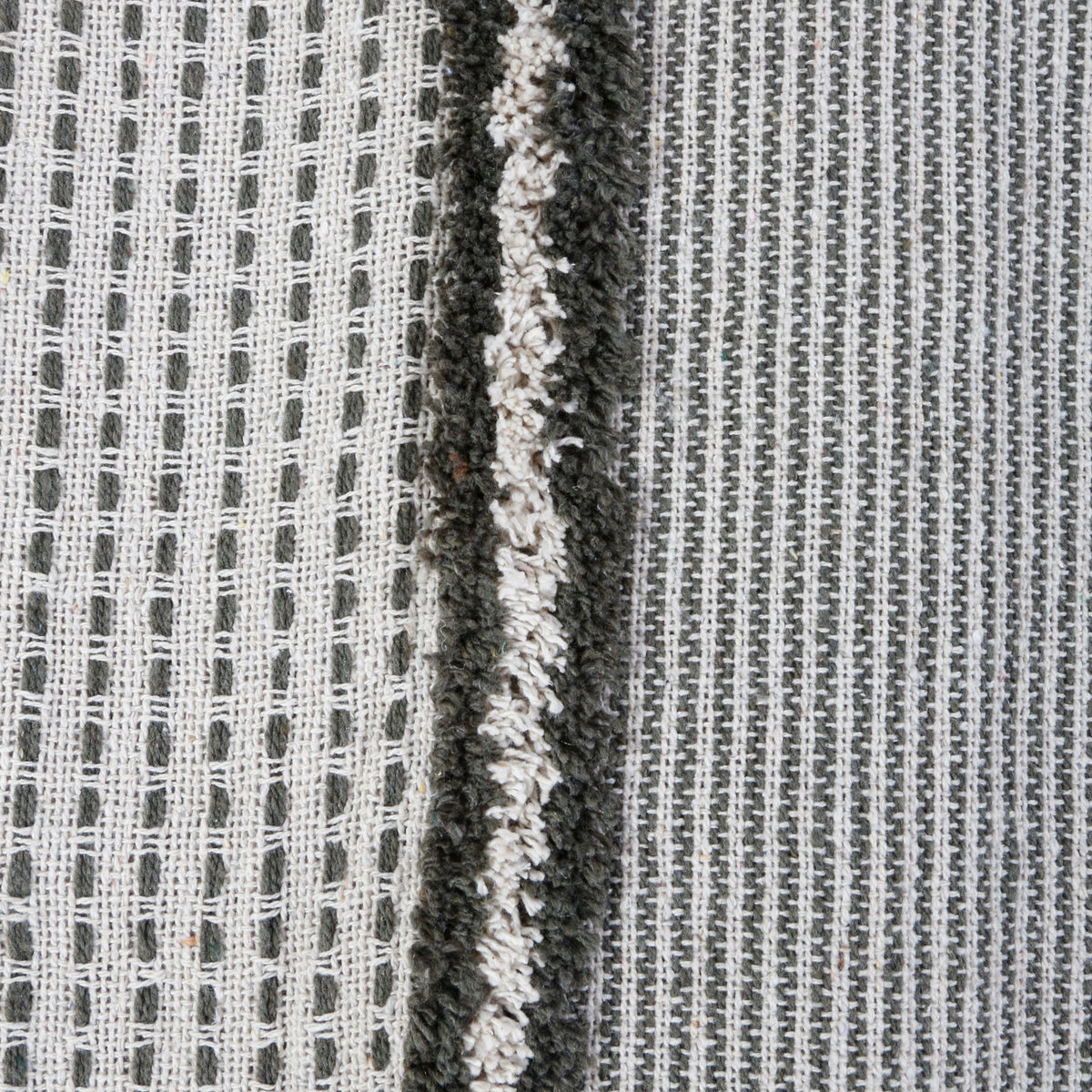 Woven throw blanket with vertical grid pattern, off-white and charcoal stripe detail